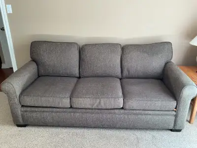 Two couches and a leather ottoman, View more