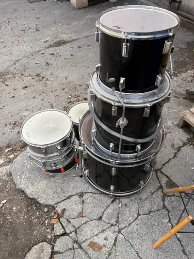 Old dusty Pearl kit with three snares and three toms. Some cymbal stands and hihat. Name your price...