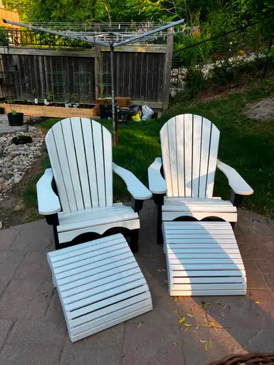 Two Adirondack chairs with bonus footstools.