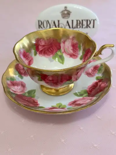 Old English Rose Royal Albert made in England. Heavy gold Avon shaped tea cup and saucer . Note : th...