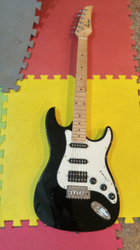 Music Tools  Rocker RG-100 electric guitar.