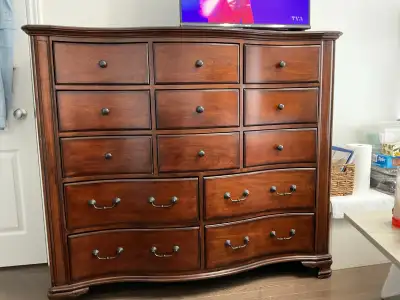 This used dresser features twelve drawers and is in good condition, perfect for adding storage space...
