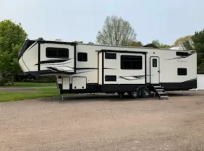 2022 Montana Highcountry. 43 feet long, 4 slides, loft upstairs, large fridge, 3 couches. It's like...