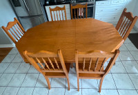 Solid oak table & 6 chairs.