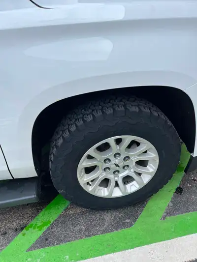 18 inch Aluminum Rims with Original Hub Caps and with Bridgestone K02 All TERRAIN Tires - 80% tread...