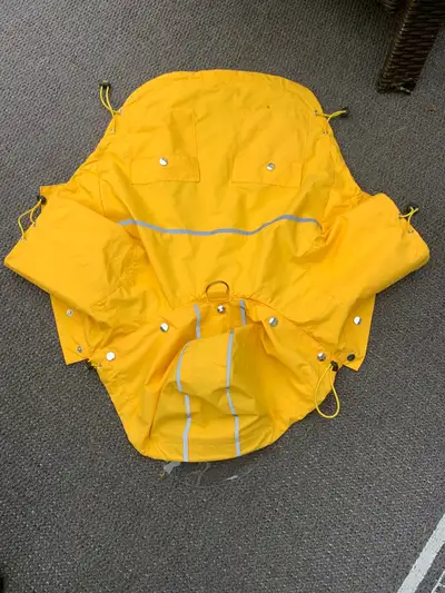 Doggy raincoat with reflective markings ,size large for smaller dog,excellent condition. Call 902-68...