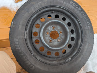 225/60R16 All season tires on rims- free hubcaps.