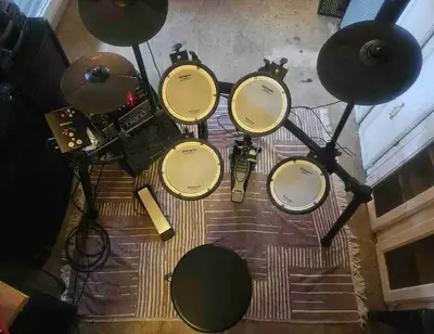 Selling my used Roland electric drum kit, And Roland Pm 100 personal monior, Which is perfect for pr...