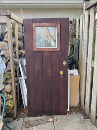 Used wooden door with hinges still attached 