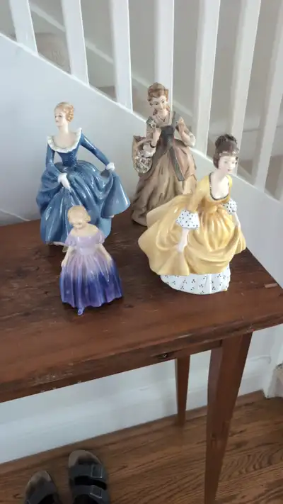 four royal dalton vintage figurines....antique been in family over 50 years....selling the lot in on...