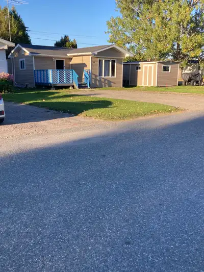 Mobile home for sale. Looks more like a house that’s in a trailer court. Has three full bed rooms, 1...