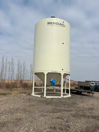 Farm Equipment Retirement Sale: 2023 Meridian GM4000 hopper bottom grain bin, 4100 bushel. Custom ae...
