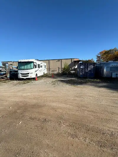 Parking/storage spots available at a gated, secure outdoor storage facility with packed gravel and v...