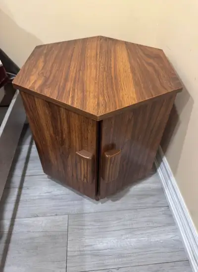 This is a used hexagon-shaped coffee table, perfect as a unique accent piece in any living space. Th...