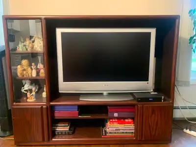 Giving away for free, TV entertainment unit. Approx dimensions are 63" x 19" x 50". Only the enterta...