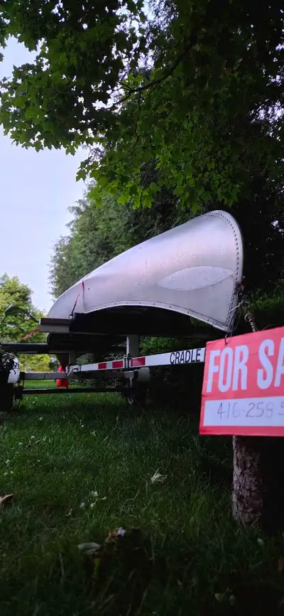 Canoe and trailer sold together. Serious inquiries only, contact 416-258-5548.