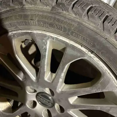 Offering a set of Michelin winter tires mounted on Volvo alloy rims, size 205 50R17. These tires hav...
