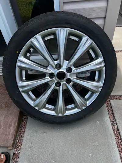 I'm selling a used rim and tires, size 235/45ZR18 98W. It's in good condition.