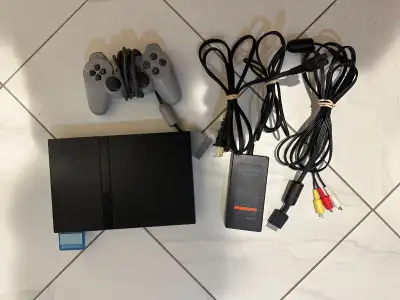 PS2 Slim, Controller, Memory Card and 26 Games $360, View more