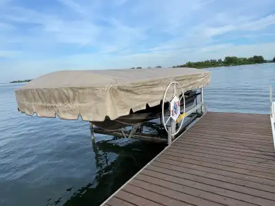 3900lb boat lift. New stainless cables and carpeted side guide bunks last year. 22’ roof so you neve...