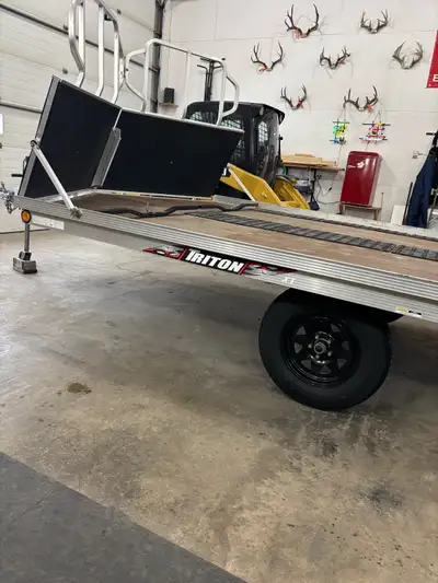 All aluminum triton trailer drive on drive off with super glides trailer in excellent condition new...