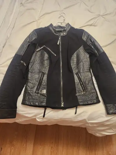 Brand new, never worn womens Haley Davidson riding jacket. Size M. $200 obo