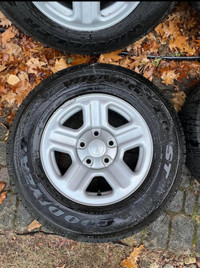 Set of 16” OEM Jeep Wrangler On Goodyear Wrangler ST Tires