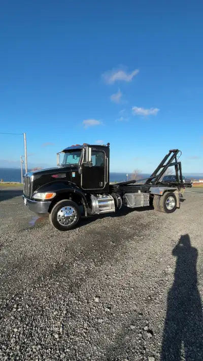 2018 peterbilt 337 roll off, 12,000lb , cummins 300hp,Allison auto, air brake, air ride, locking dif...
