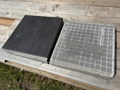 12” x 12” black/dark grey slate tiles. Like new. 16 pieces.