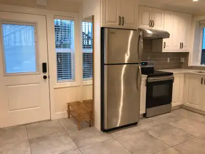 - 840 Sq. Ft. of bright living space in the half basement of a new house - maximum of 2 people, stud...