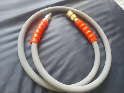 This is a used pressure washer hose in good condition, ready to boost your cleaning power with its d...