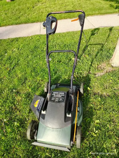 A reliable Black & Decker 18-inch corded electric lawn mower, runs smoothly, and starts instantly wi...