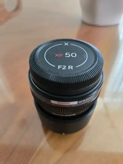 Excellent condition Fujinon XF 50mm f/2 R WR lens. Lens was made in Japan and comes lens hood, front...