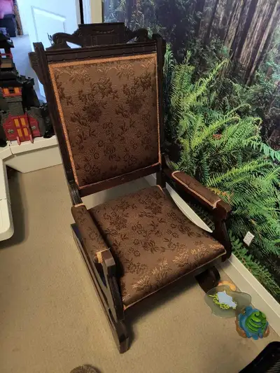 Antique victorian platform rocking chair. Don't know the age. No manufacturing information. 2 wood w...