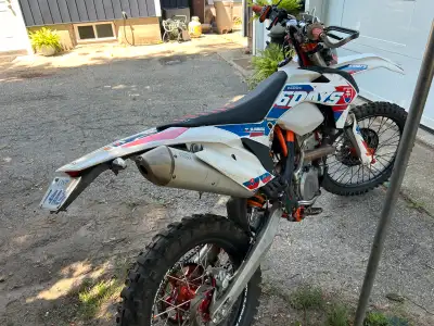 Six days, blue plated, great bike no time to ride. 99 hours. Adjustable stand, truck ramp and some r...