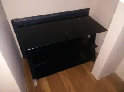 Nice black glass stand with 3 shelves in nice condition. Very solid & modern to suit a variety of de...