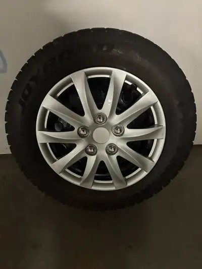 4 Winter tires,rims and hubcaps. Tires are in very good condition and hubcaps are four months old.Si...