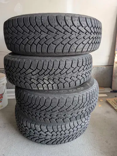 Set of 4 Goodyear winter/snow tires, size 225/65R17, mounted on steel rims. M+S rated for winter per...