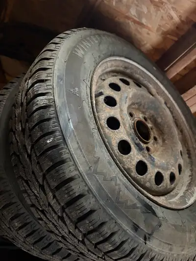 These are 205/65/R16 tires mounted on steel rims. The tires are winter tires and are in used conditi...