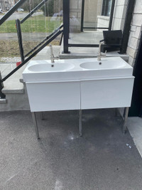 Two person white sink, with drawers.