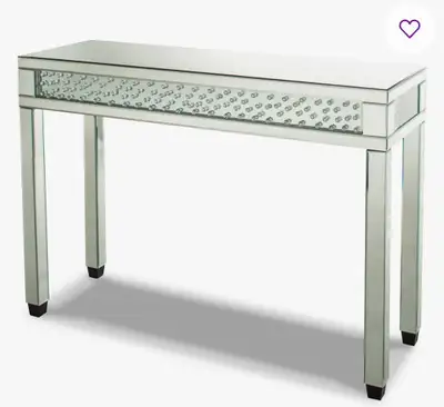 Add a touch of glamour to your entryway or living room with this mirrored console table, featuring a...
