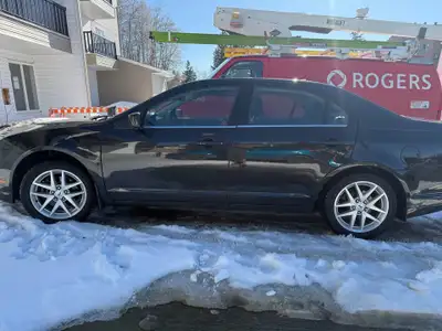 2012 Ford Fusion SEL AWD 193,527 Great for winter driving with the all wheel drive Has minor front b...