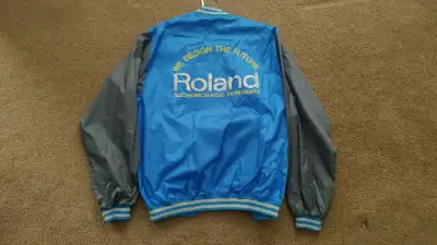 I have this vintage and rare Roland Electronic Synthesizer Jacket. It's a size large and it's in per...