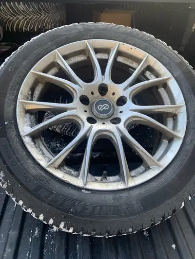 Michelin brand new snow tires . 215/55R17 . Less than 400 km. Sport rims included . Fits Nissan Alti...