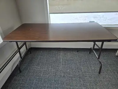 Brown mahogany look table top folding tables with metal legs. Only used in office setting , good con...