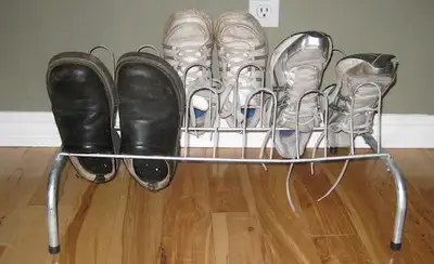 2 Aluminum Shoe Racks each rack holds 9 pairs of shoes each perfect if you keep your shoes outside o...