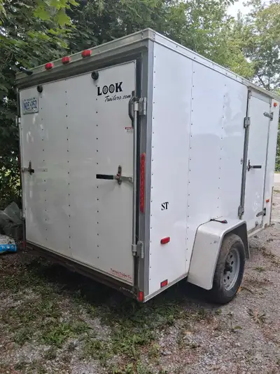6 ft x 10 ft enclosed Look trailer with side door and ramp. 2016 with ownership. Used twice to trans...