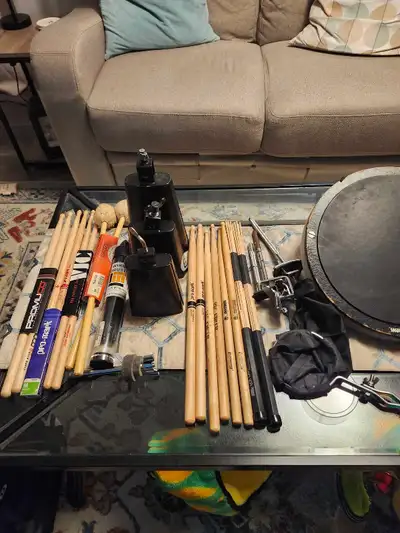 Assorted drum/percussio items (Sticks, cowbells, headphones,...), View more