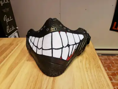Smirkster 100% leather biker mask. Hand tooled and made here in Halifax. Suede lined and perimeter s...