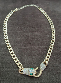 Luxury snake necklace gold color thick chain has some weight.
